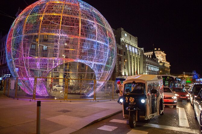 Christmas Lights Tour of Madrid in Eco Tuk Tuk Private - Salamanca’s decorated avenues