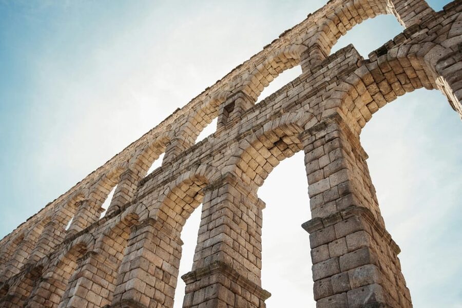 From Madrid: Half-Day or Full-Day Trip to Segovia - Starting beneath the Roman aqueduct