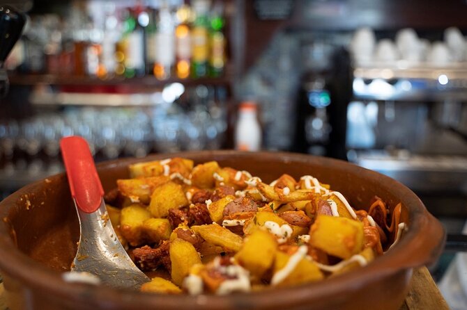 Madrid by Night: Tapas Crawl, Local Drinks & Hidden Gems - Guides make the difference