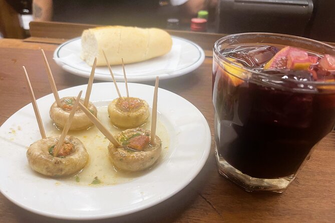 Madrid Food Tasting Tour of Hidden Gems (Small Groups) - First stop: calamari sandwich and local beer
