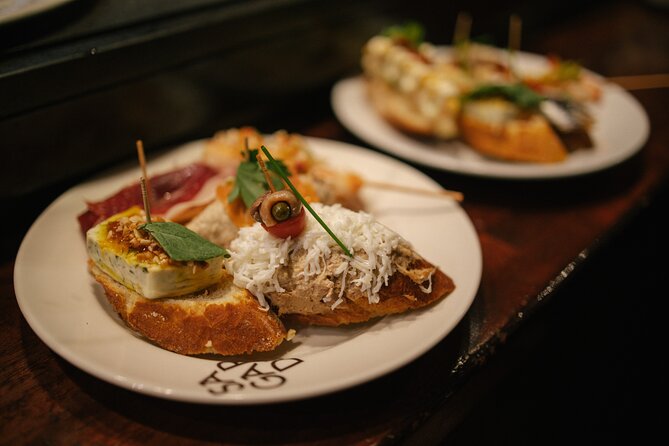 Madrid Food Walking Tour with Tapas and Vermouth - Chorizo-stuffed mushrooms at Cava de San Miguel