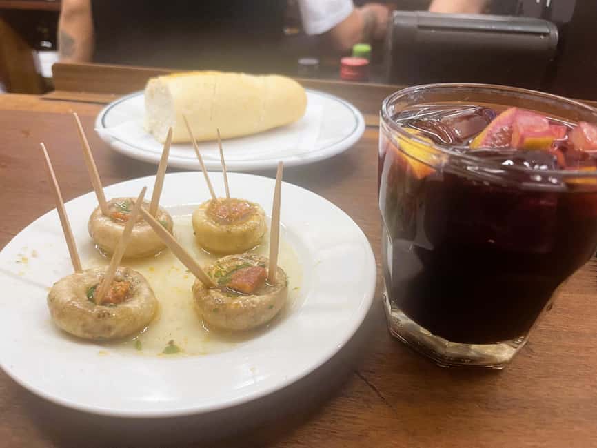 Madrid: Guided Local Food Tour at Hidden Gem Restaurants - Stop five: Ham and spider crab croquettes with local wine