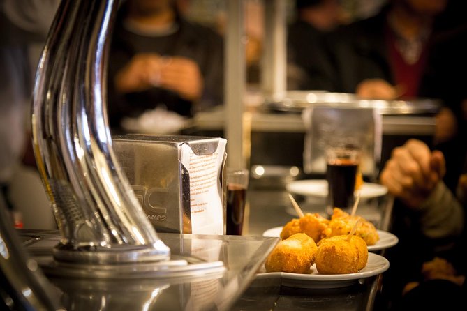 Madrid Local's Tapas Tour Dinner with a side of History - Calle Preciados and the croquette stop