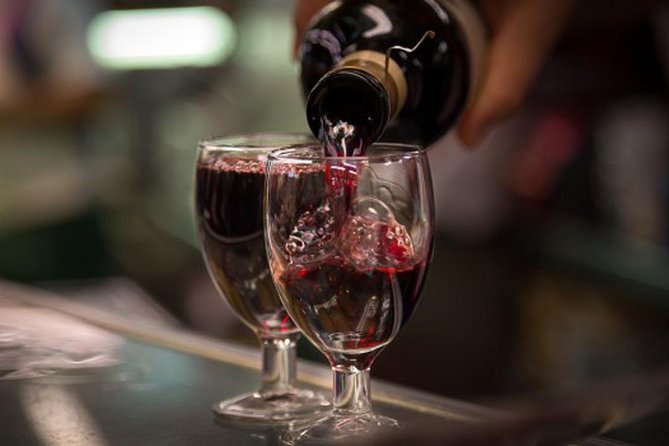 Madrid Local's Wine and Tapas Lunch Tour with a side of History - Starting with wine near Plaza Isabel II