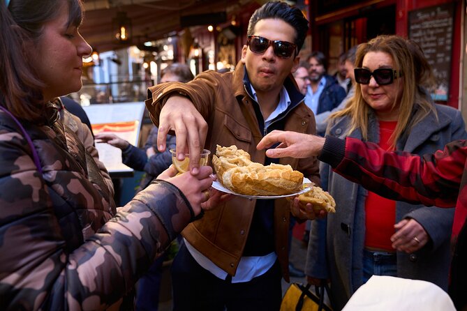 Madrid: Not Just Another Tapas & Wine Tour by Eating Europe - Plaza Mayor, chocolate, and the sweet finish