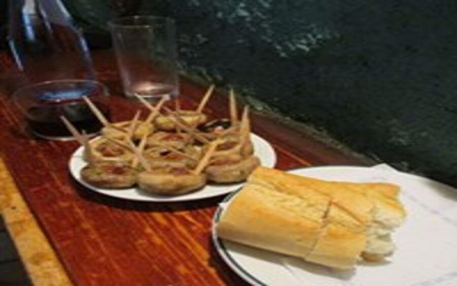 Madrid: Old Madrid Walking Food and Wine Tour - Garlic prawns, chorizo, bravas, and more