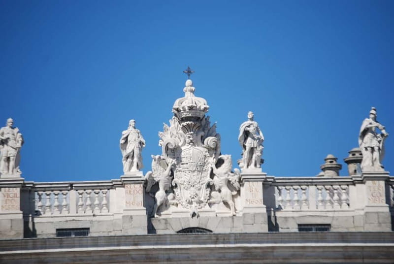 Madrid: Royal Palace Private Tour with Tickets - Walking into the Royal Palace through the local guides entrance