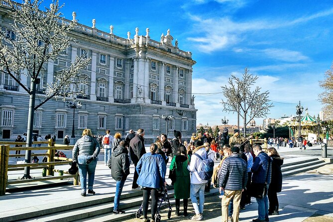 Madrid Royal Palace Professional Guided Tour with Skip the Line - Crossing Plaza de Oriente