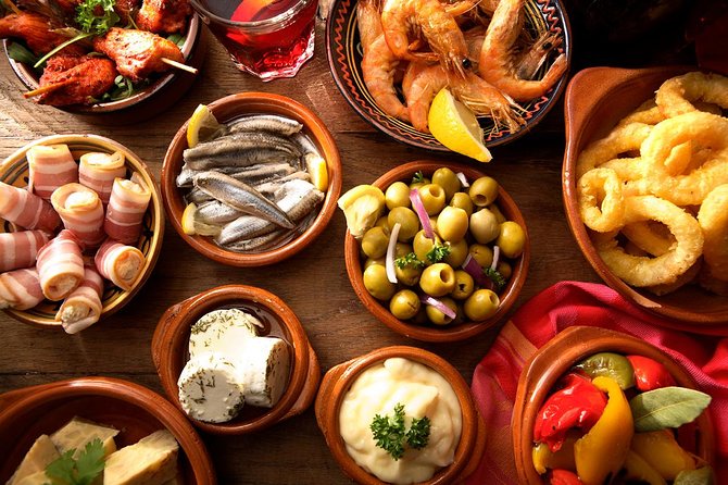 Madrid Tapas Experience Walking Tour - Wineskins, cider, and the drinks included