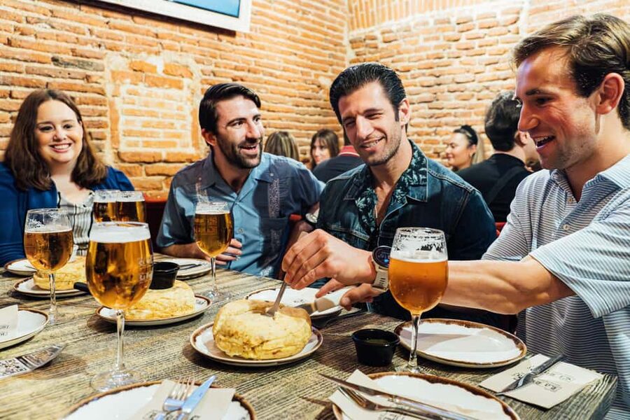 Madrid: Tapas Food Tour with Drinks and Food - The guides shape the experience