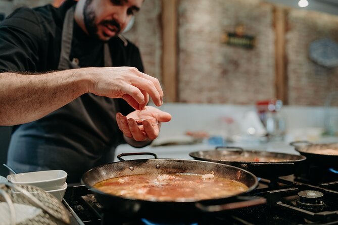 Madrid Tapas & Paella Cooking Experience with Local Market Visit - Sitting down to a proper Spanish lunch