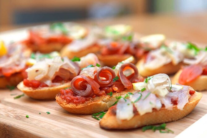Tasty Tapas & Drinks Tour with a Rooftop Included - Patatas bravas and the first Madrid pour